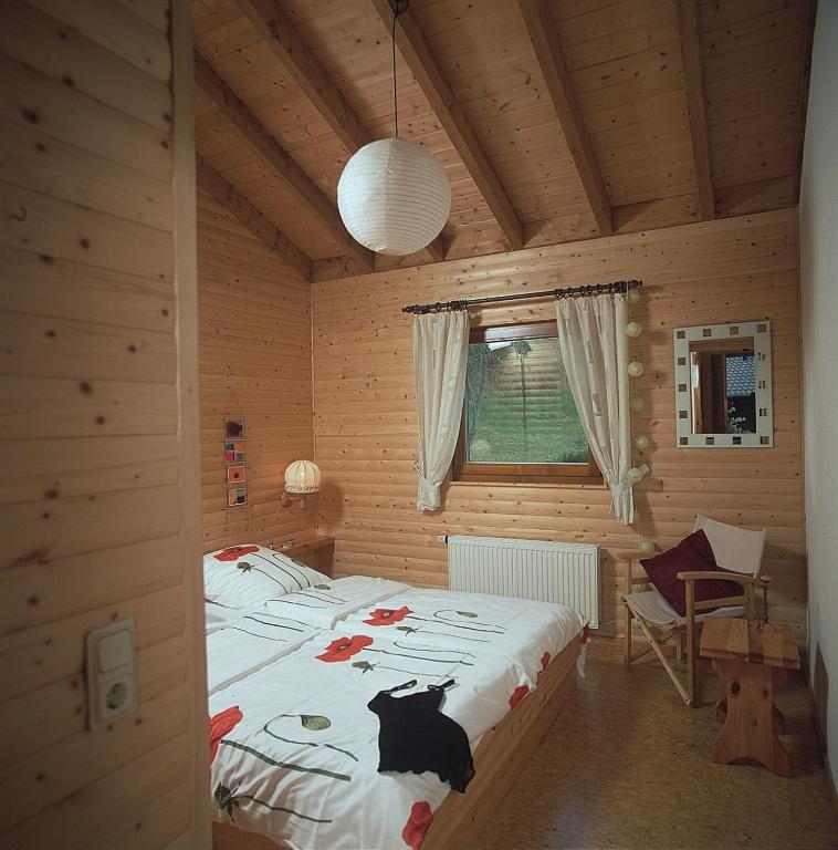 Postel nebo postele na pokoji v ubytování Haus 2 - Typ B (Blockhaus)