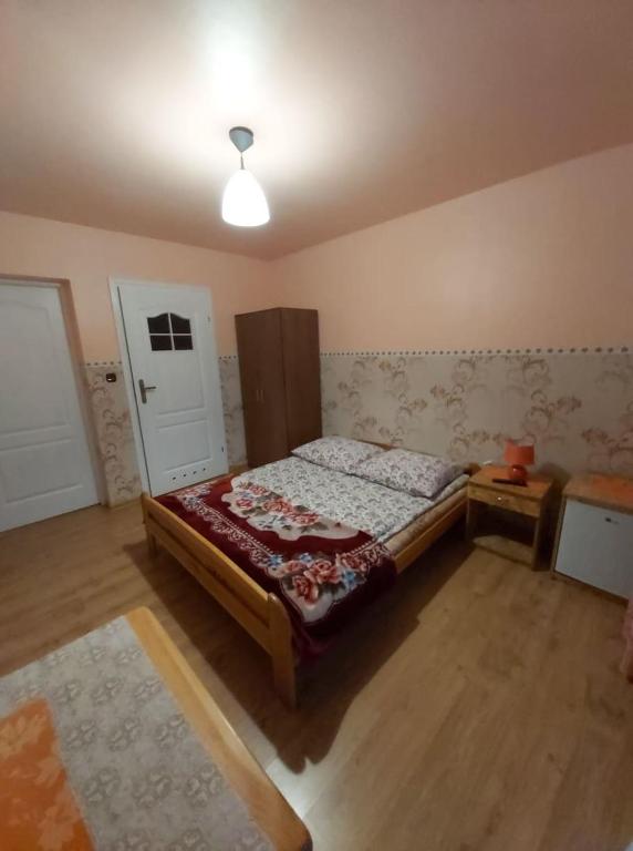 Posteľ alebo postele v izbe v ubytovaní Dom pod Winogronem