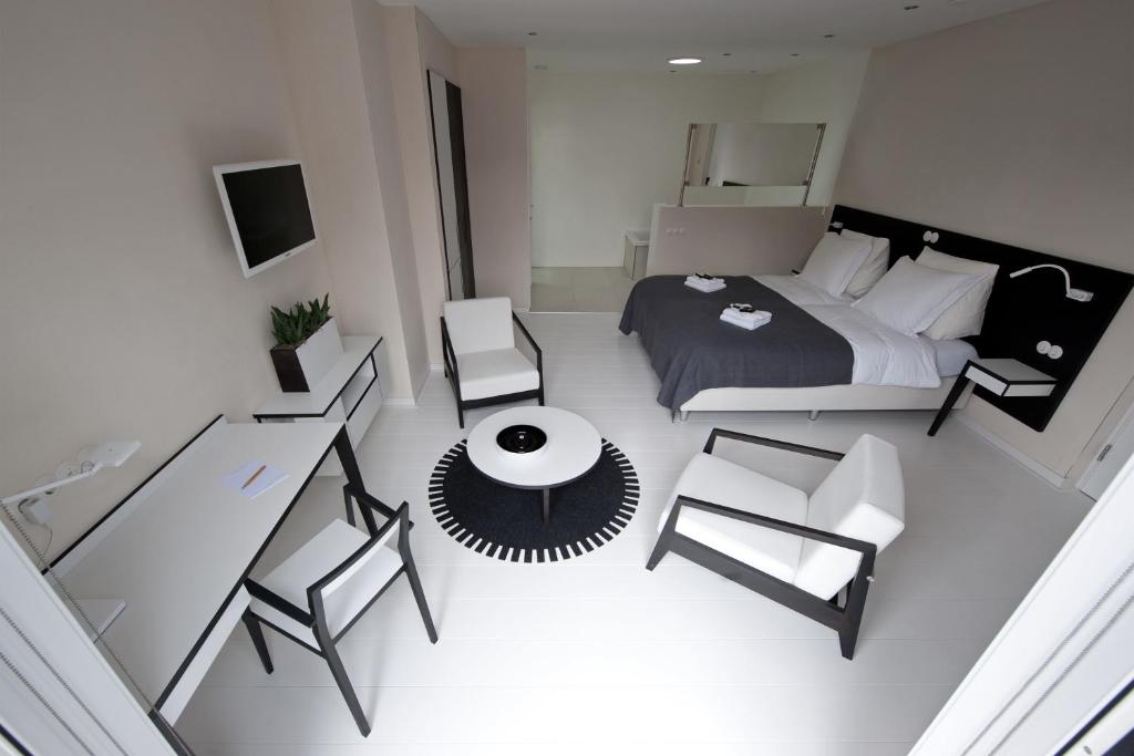 Postel nebo postele na pokoji v ubytování Asgard Hotel