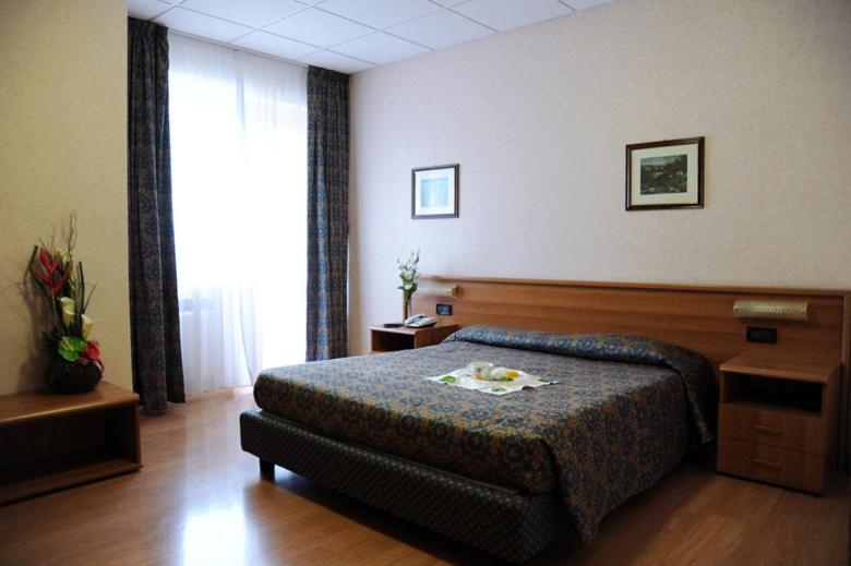 Postel nebo postele na pokoji v ubytování Park Hotel