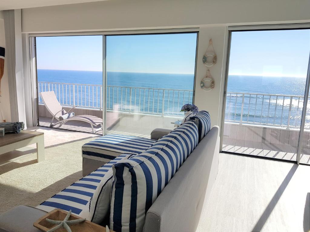 a living room with a view of the ocean at Blue Sea Apartment in Póvoa de Varzim