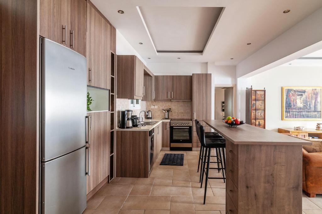 A kitchen or kitchenette at Kleio by Heloni Apartments