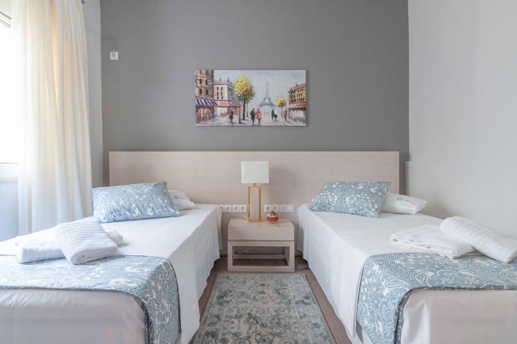 A bed or beds in a room at Kleio by Heloni Apartments