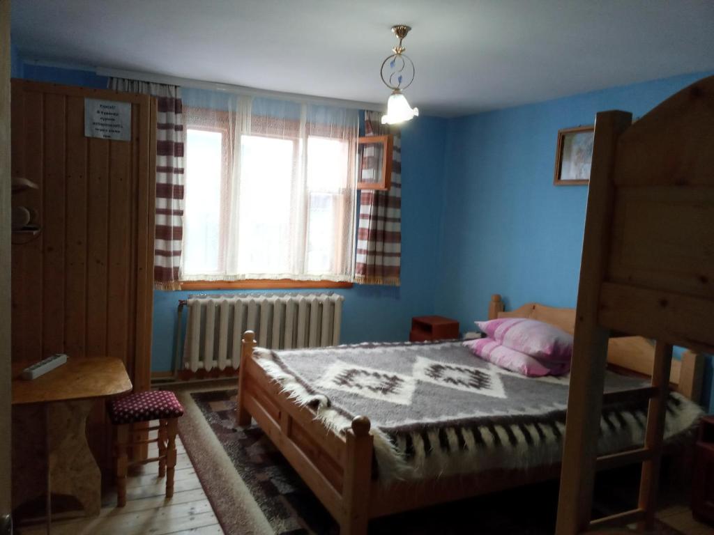 Postel nebo postele na pokoji v ubytování Na gorbochku u Natali