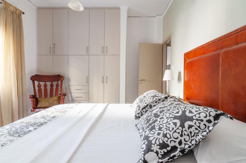 A bed or beds in a room at Kleio by Heloni Apartments