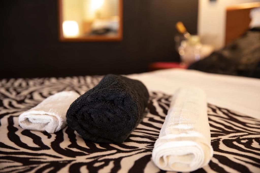 Postel nebo postele na pokoji v ubytování Hotel Merlino