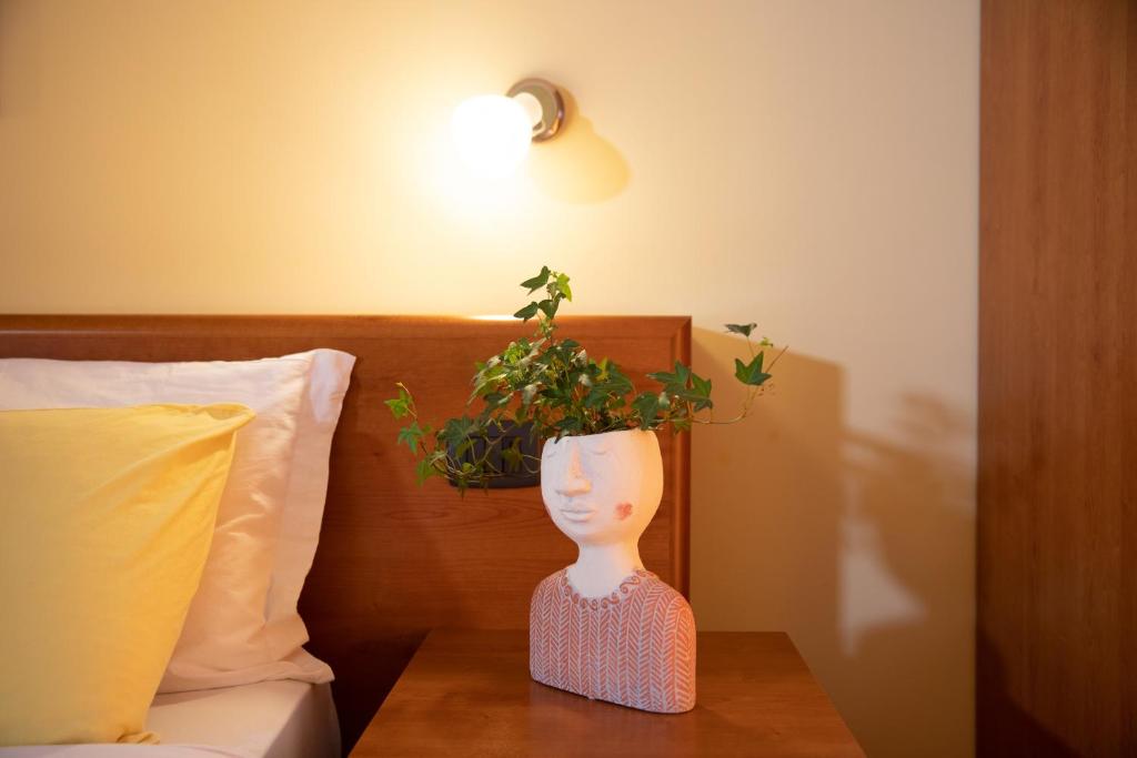 Postel nebo postele na pokoji v ubytování Hotel Merlino