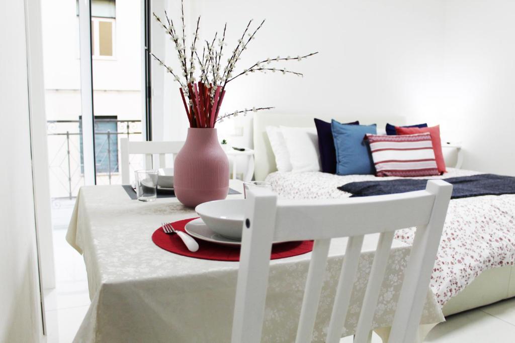 Posteľ alebo postele v izbe v ubytovaní Conforti Apartment
