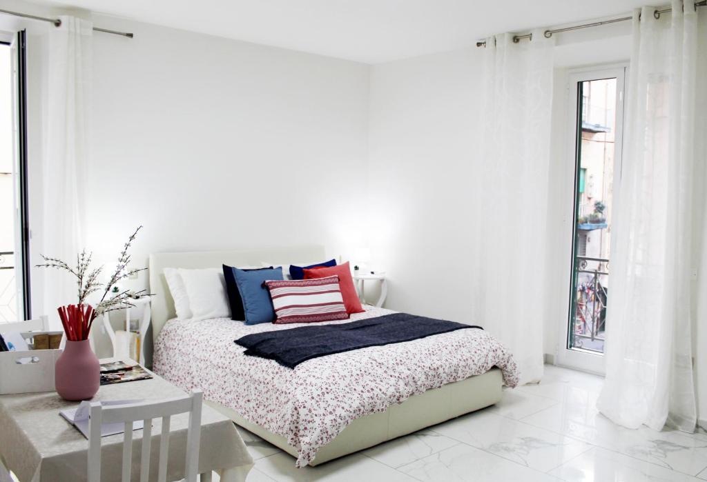 Posteľ alebo postele v izbe v ubytovaní Conforti Apartment