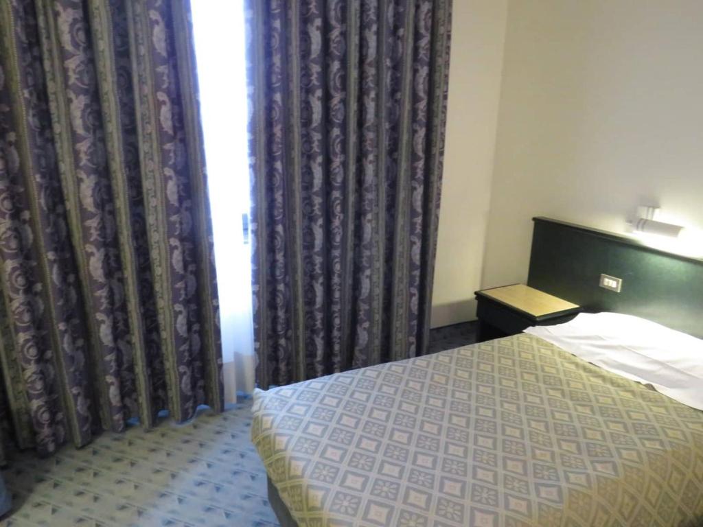 Postel nebo postele na pokoji v ubytování Hotel Turandot
