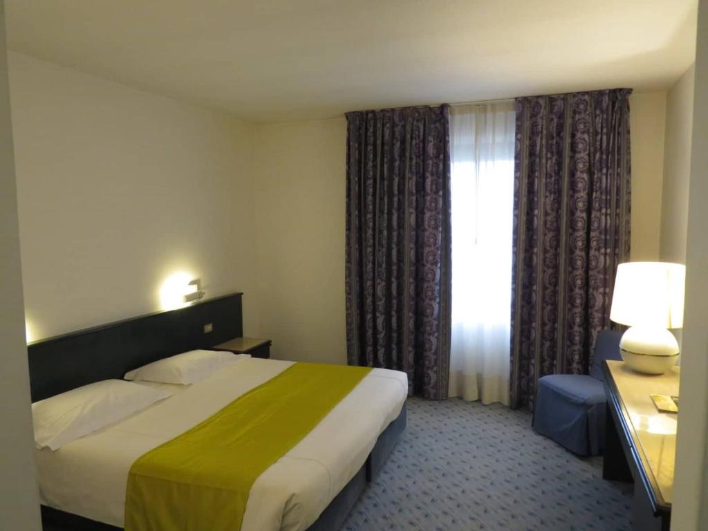 Postel nebo postele na pokoji v ubytování Hotel Turandot