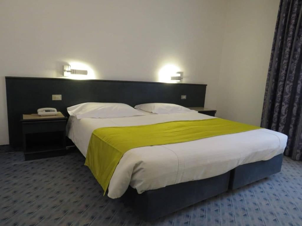 Postel nebo postele na pokoji v ubytování Hotel Turandot