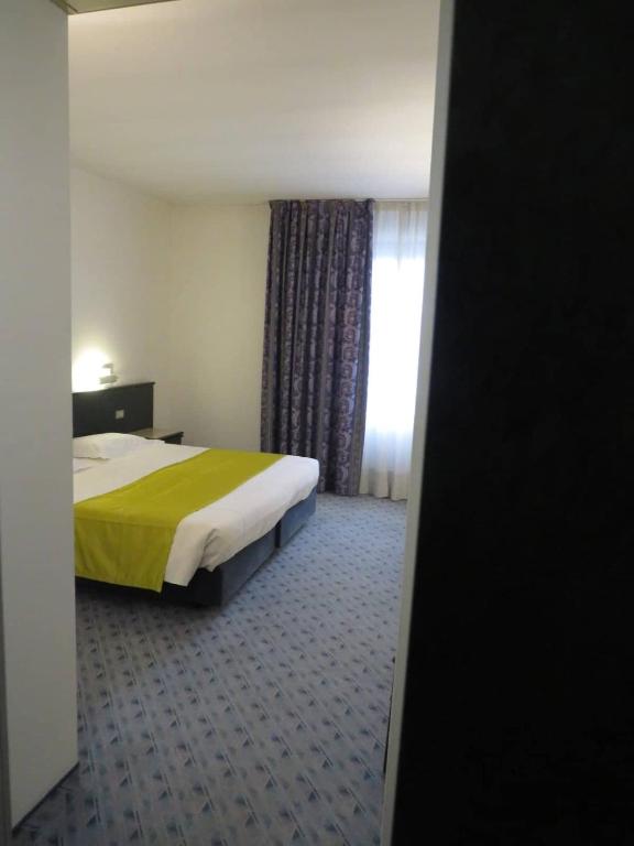 Postel nebo postele na pokoji v ubytování Hotel Turandot