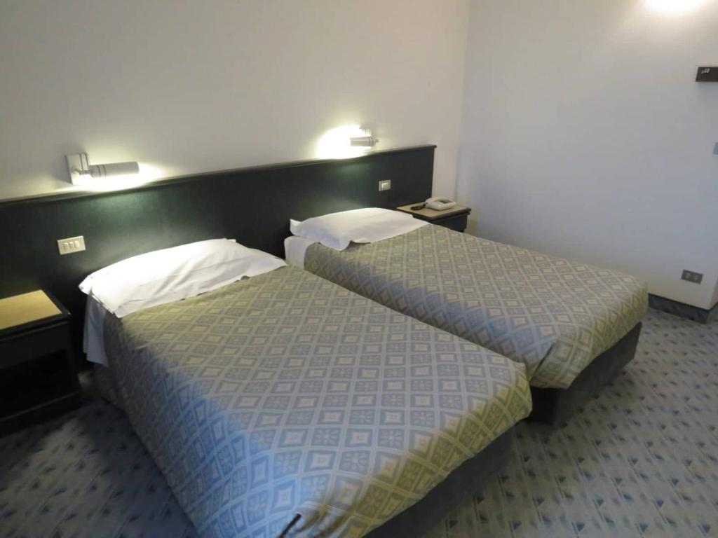 Postel nebo postele na pokoji v ubytování Hotel Turandot
