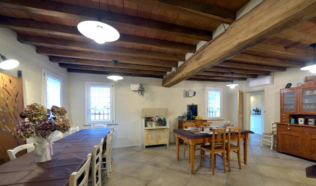 a large dining room with a long table and chairs at Antico Podere Emilia in Reggio Emilia