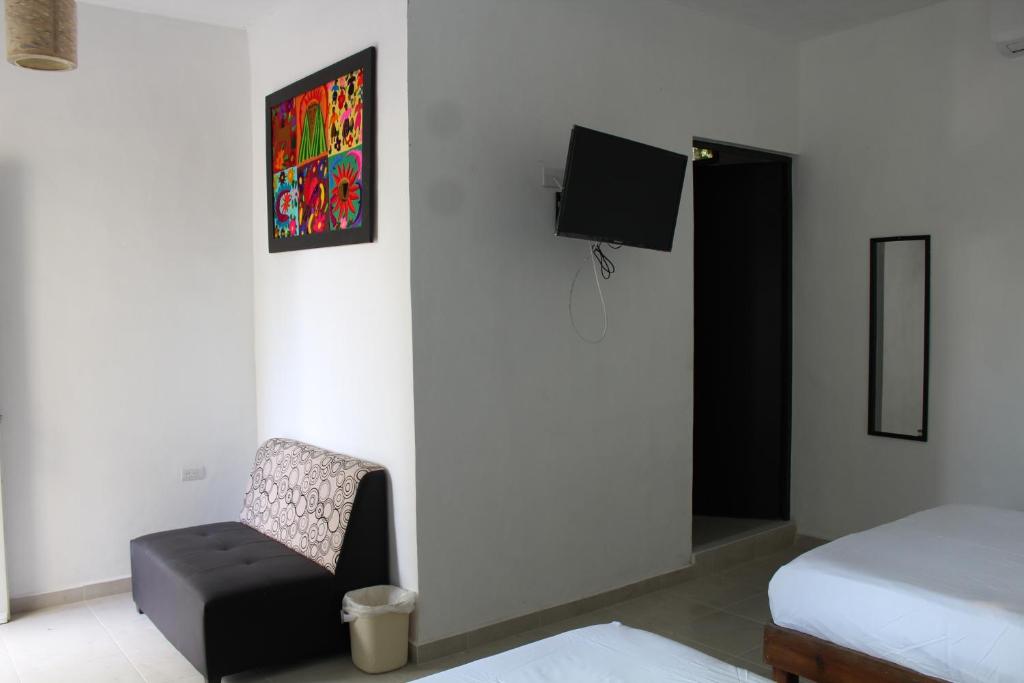 TV a/nebo společenská místnost v ubytování Hotel Casona Margot