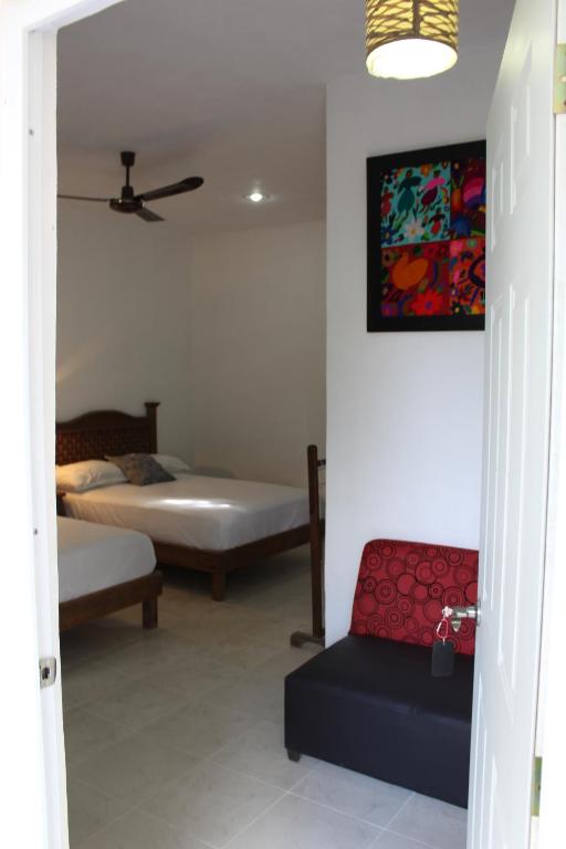 Postel nebo postele na pokoji v ubytování Hotel Casona Margot