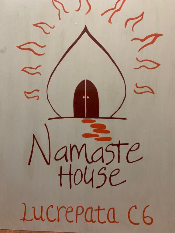 a sign for a namaste house in nigeria at Namaste House in Cusco