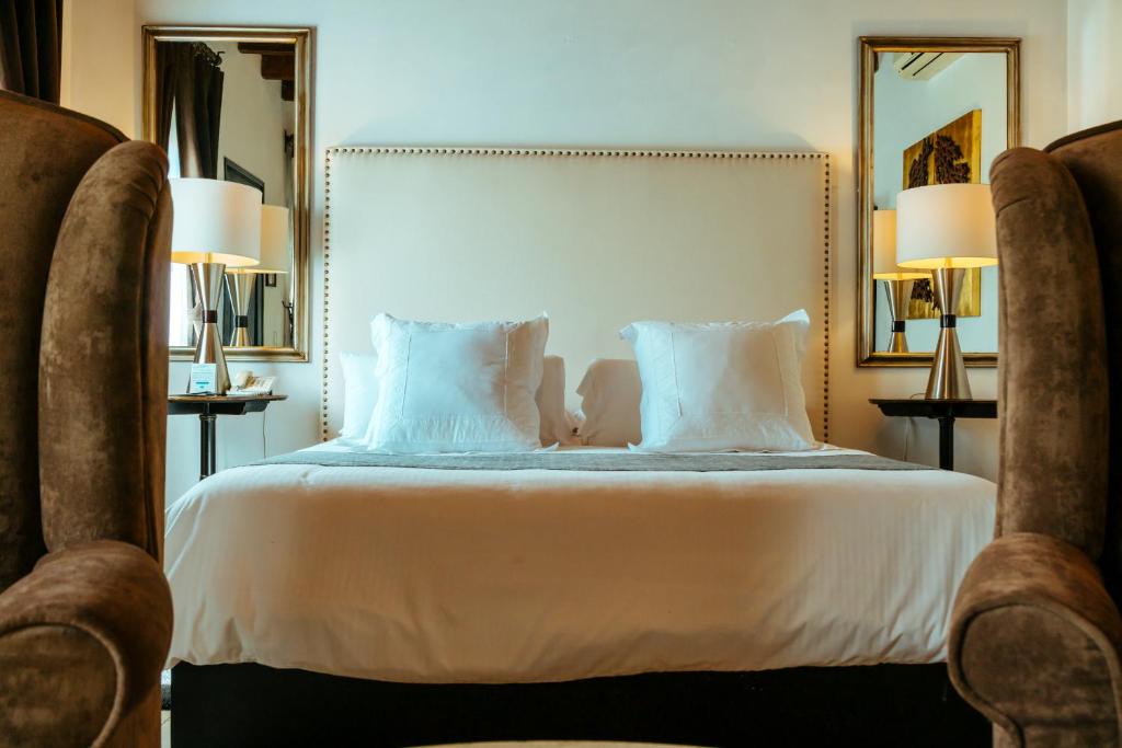 Postel nebo postele na pokoji v ubytování Hotel Boutique Hacienda Guadalupe
