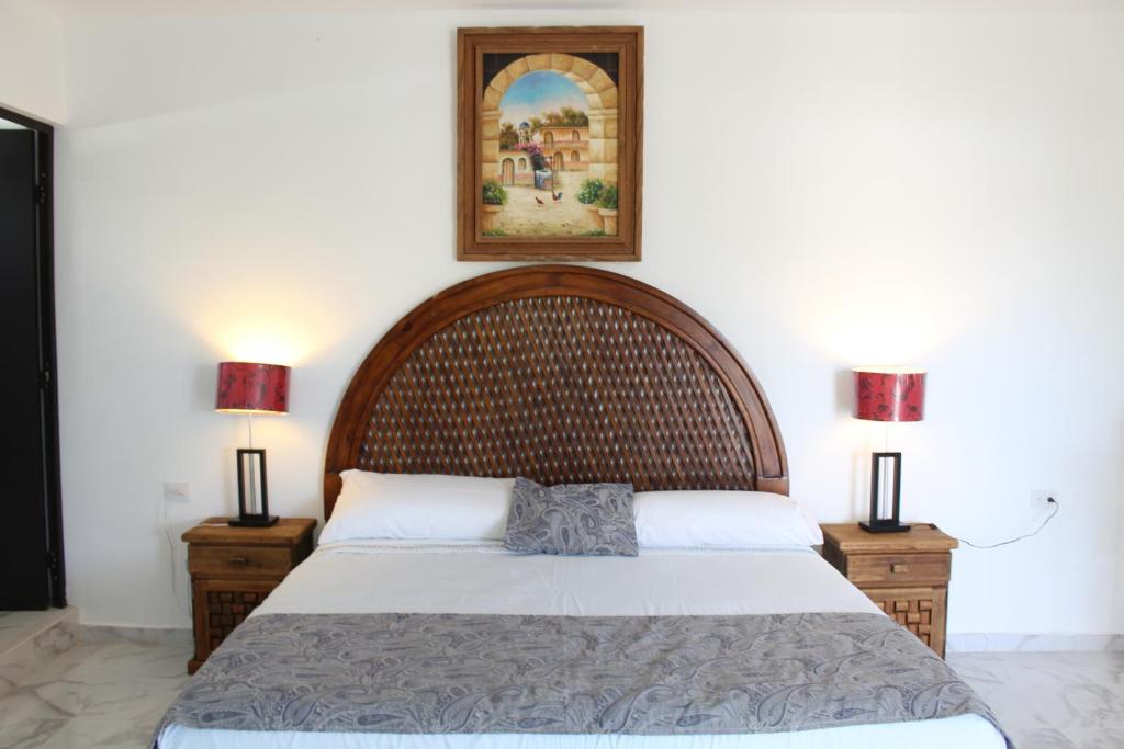 Postel nebo postele na pokoji v ubytování Hotel Casona Margot