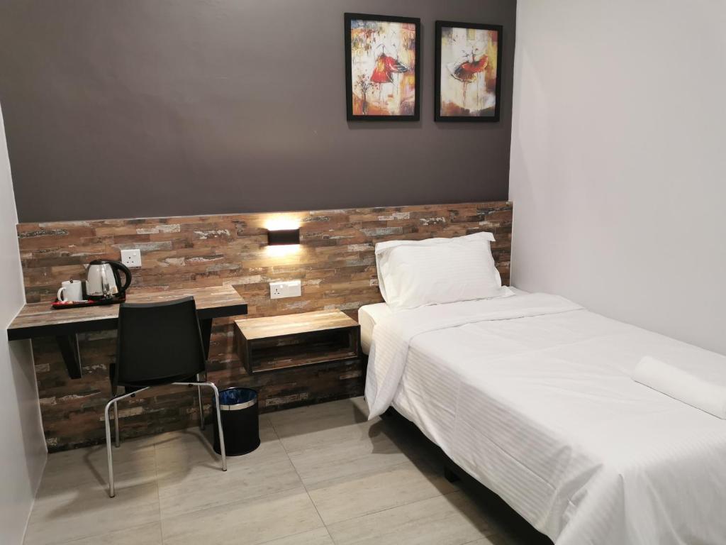 Postel nebo postele na pokoji v ubytování L Hotel