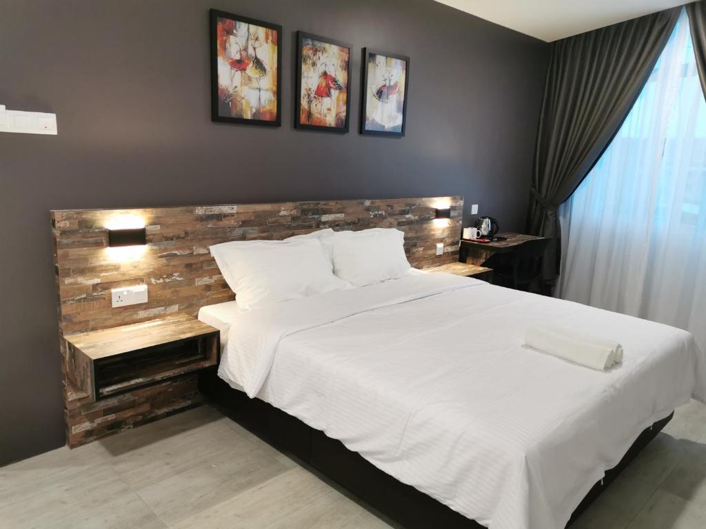 Postel nebo postele na pokoji v ubytování L Hotel