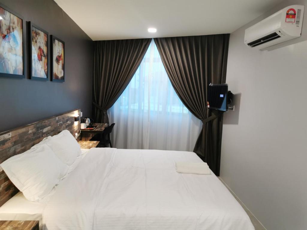 Postel nebo postele na pokoji v ubytování L Hotel