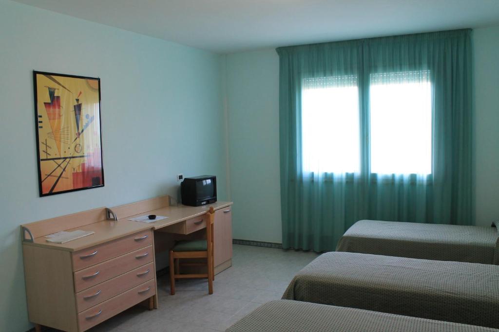 Postel nebo postele na pokoji v ubytování Hotel Minerva