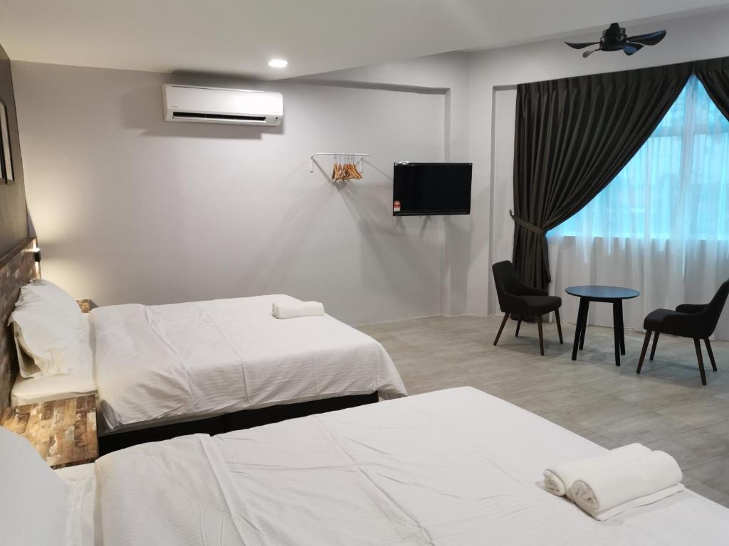 Postel nebo postele na pokoji v ubytování L Hotel