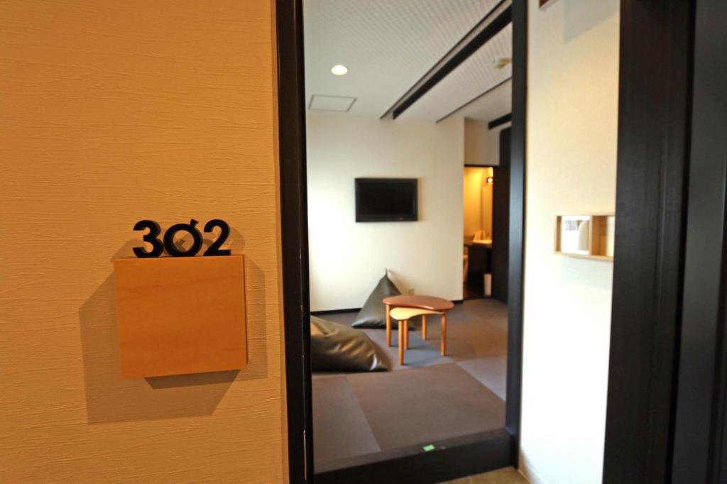 TV a/nebo společenská místnost v ubytování Hotel 3 O'Clock Tennoji
