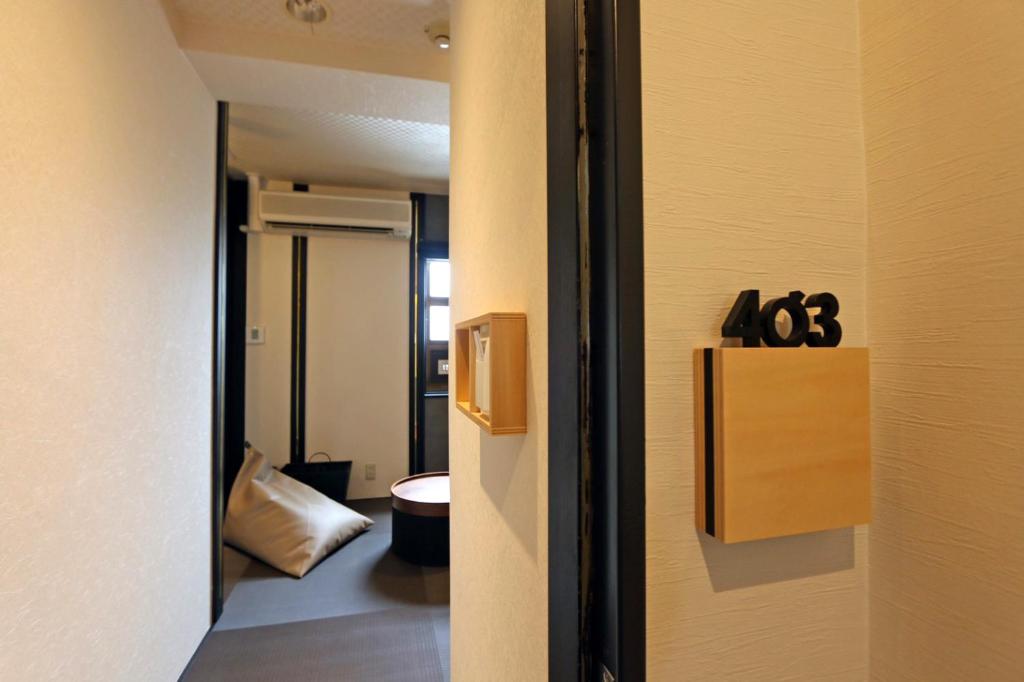 Postel nebo postele na pokoji v ubytování Hotel 3 O'Clock Tennoji
