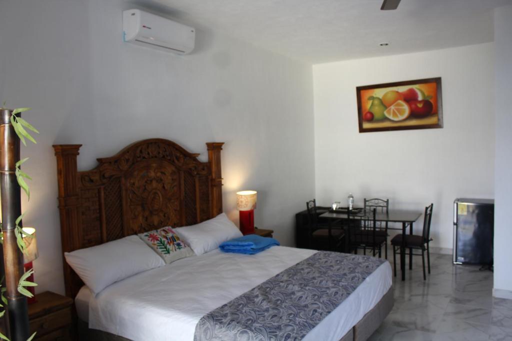 Postel nebo postele na pokoji v ubytování Hotel Casona Margot