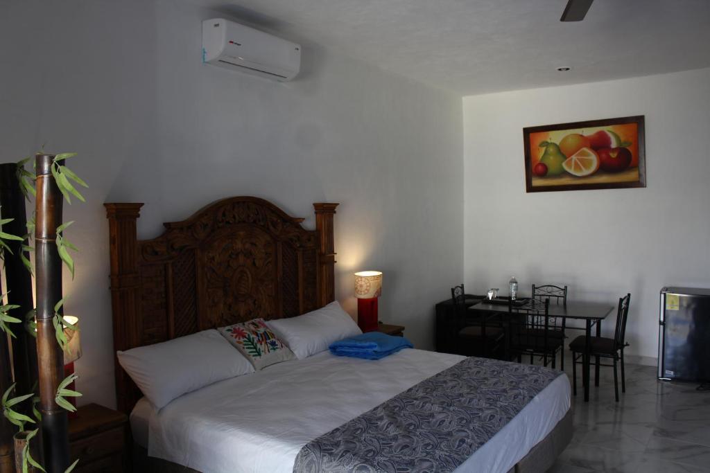 Postel nebo postele na pokoji v ubytování Hotel Casona Margot