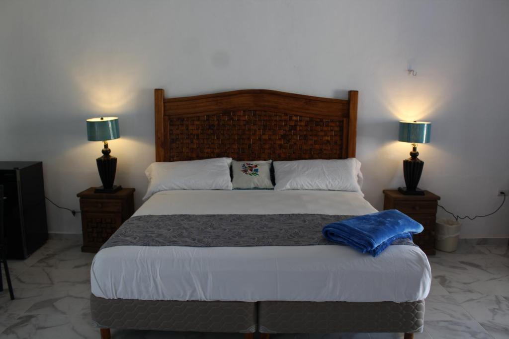Postel nebo postele na pokoji v ubytování Hotel Casona Margot
