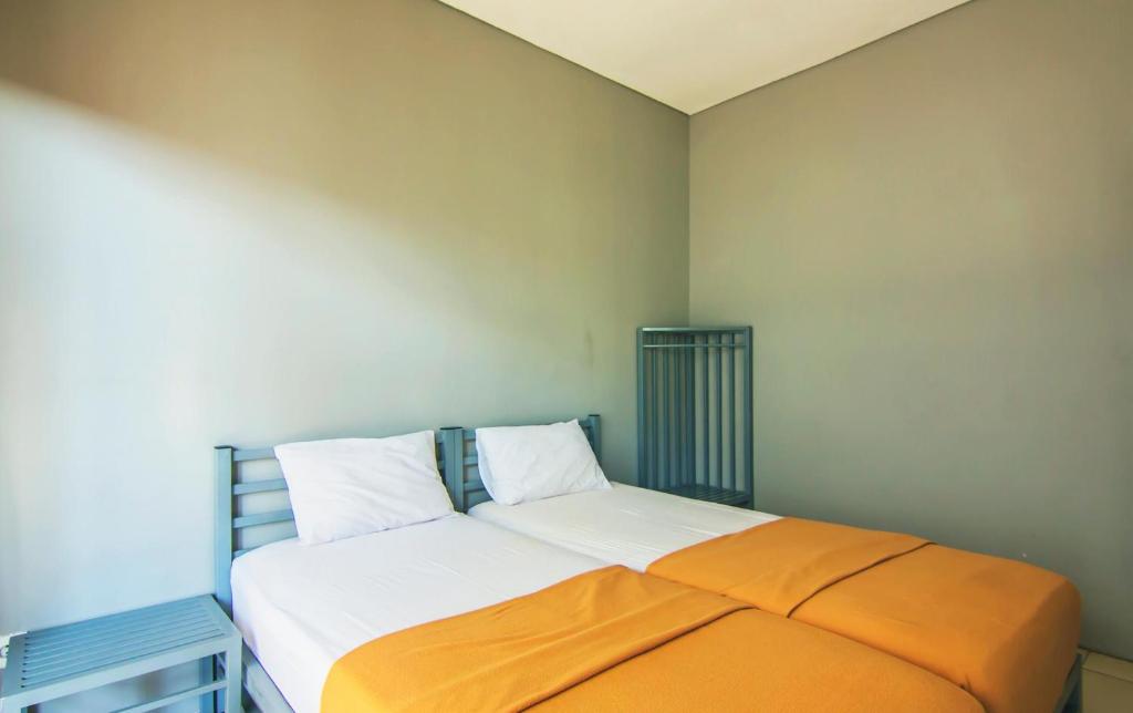 Postel nebo postele na pokoji v ubytování The Kubu Hotel
