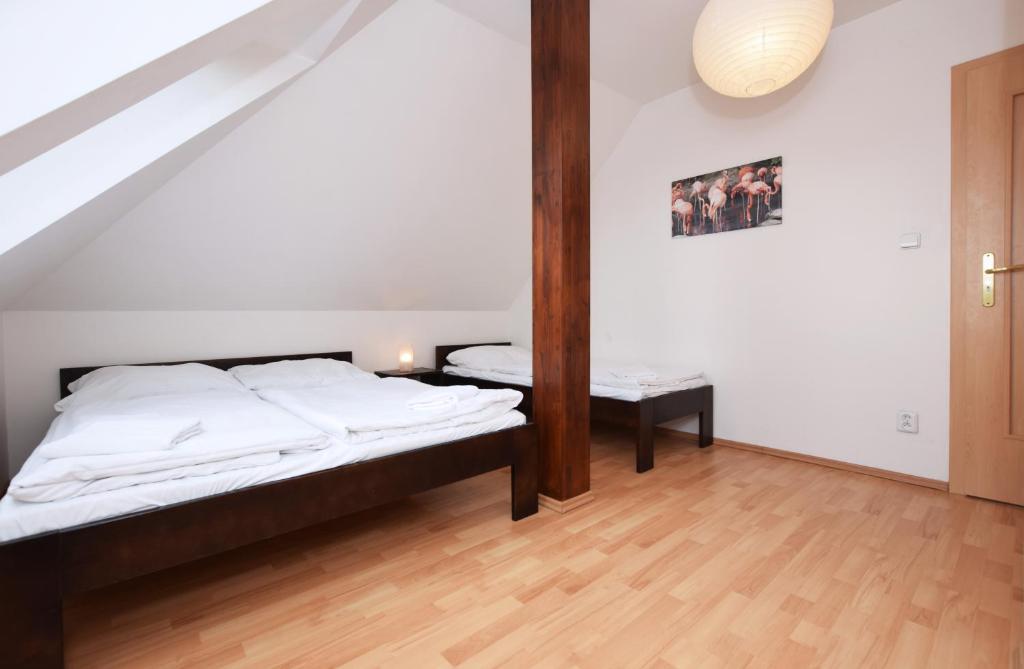 Postel nebo postele na pokoji v ubytování Flamingo Apartments