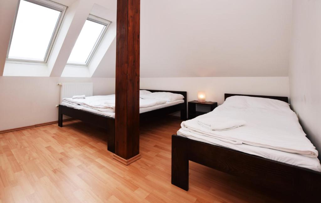 Postel nebo postele na pokoji v ubytování Flamingo Apartments