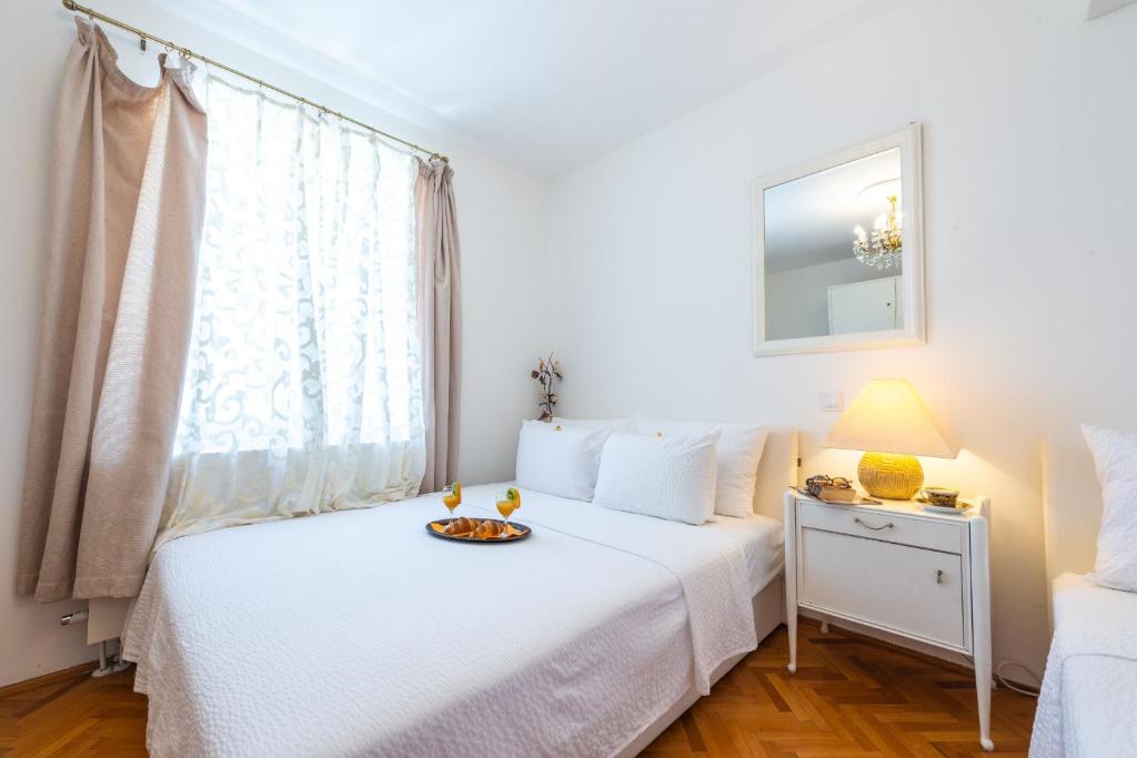 Postel nebo postele na pokoji v ubytování Villa Ida