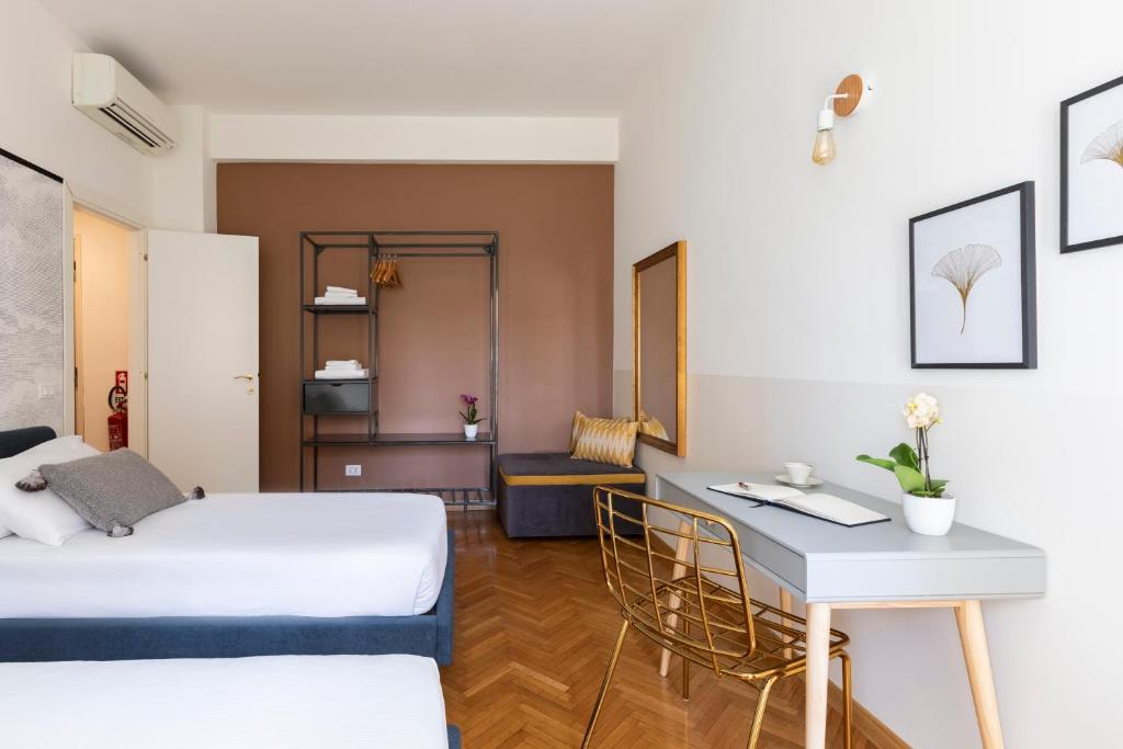 Łóżko lub łóżka w pokoju w obiekcie ROMAC San Saba 5-Bedroom and Terrace near Ostiense