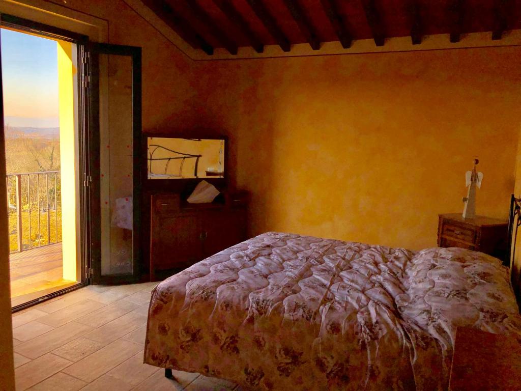 Posteľ alebo postele v izbe v ubytovaní Agriturismo I Colli