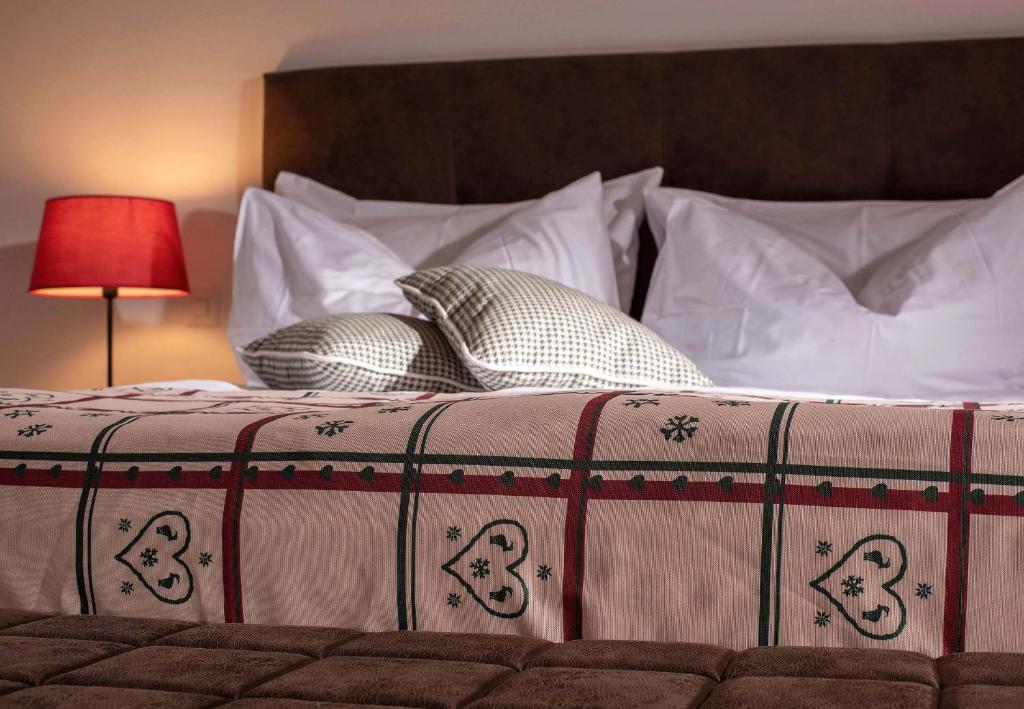 Postel nebo postele na pokoji v ubytování Hotel Kernen