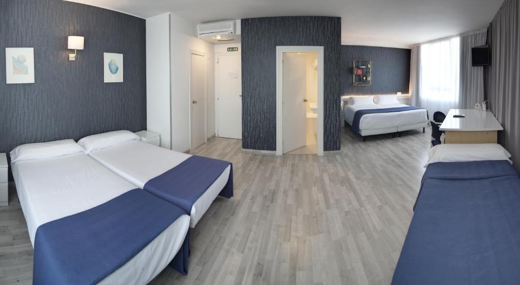Postel nebo postele na pokoji v ubytování Hotel Luze El Villa