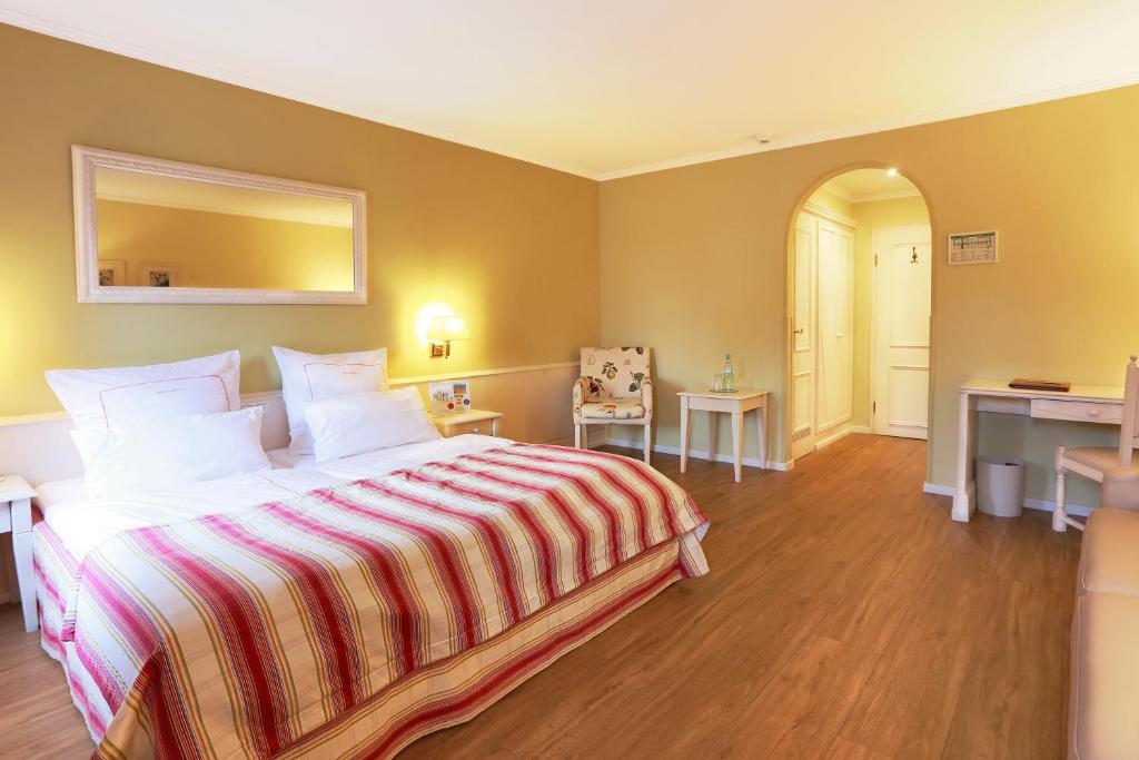 Ein Bett oder Betten in einem Zimmer der Unterkunft Blesius Garten