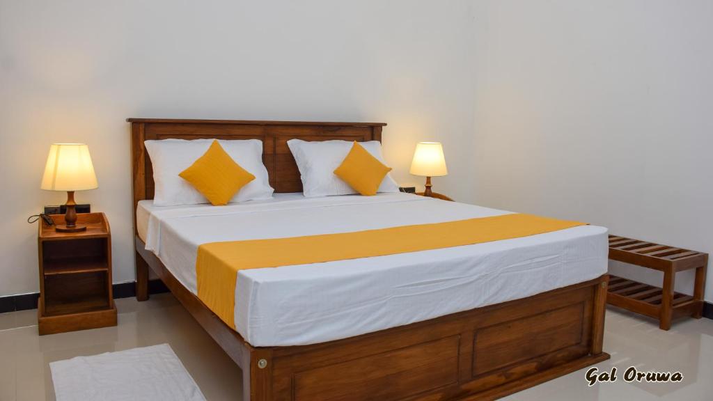 Postel nebo postele na pokoji v ubytování Gal Oruwa Resort