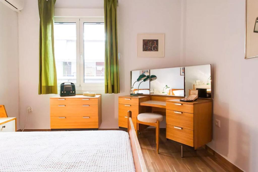 A bed or beds in a room at Athens Vintage Apartments - Pagrati