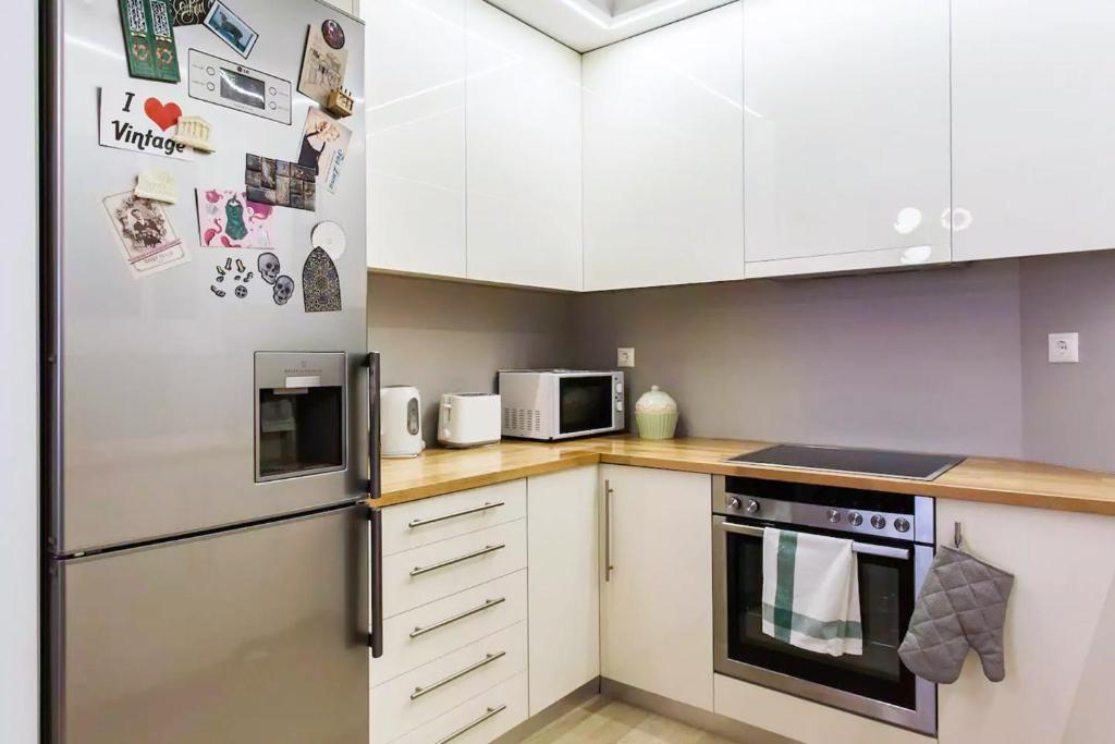 A kitchen or kitchenette at Athens Vintage Apartments - Pagrati