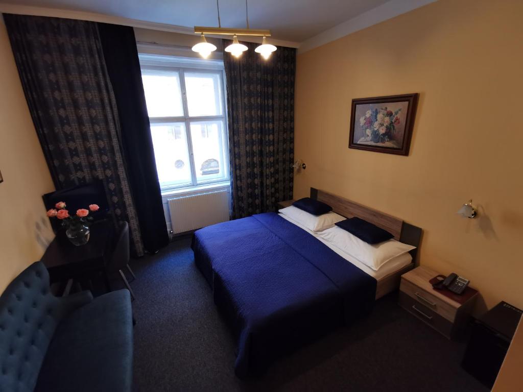 Postel nebo postele na pokoji v ubytování Hotel Bajazzo