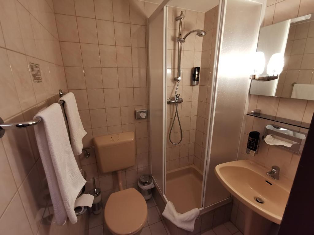 Koupelna v ubytování Hotel Bajazzo