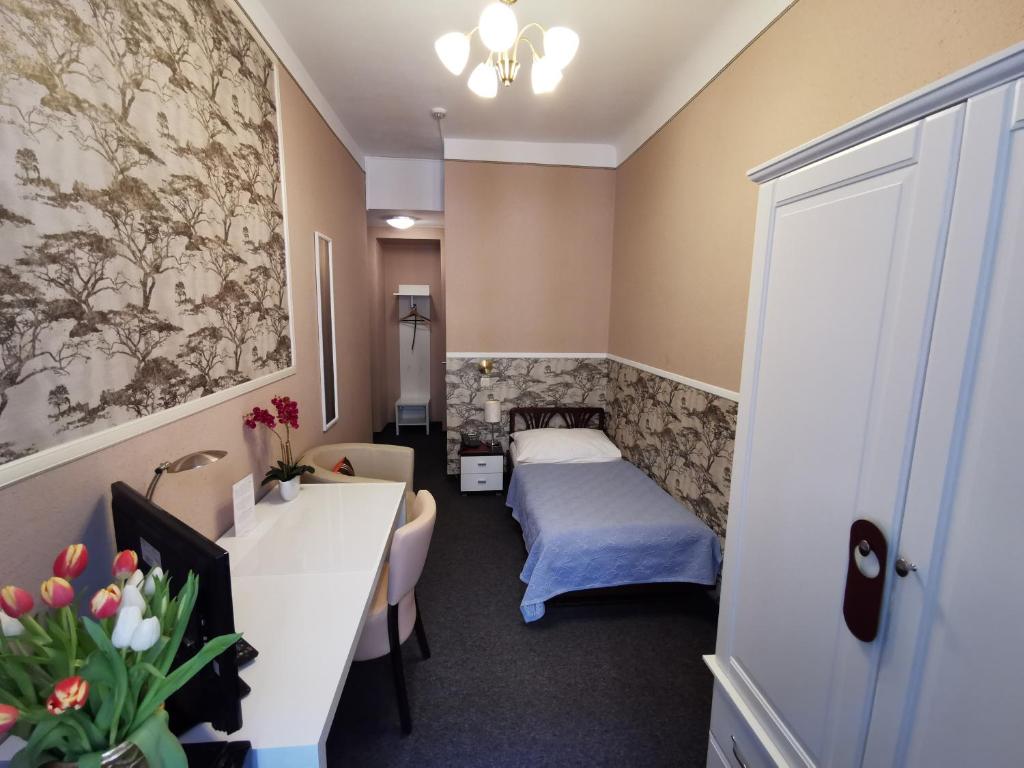Postel nebo postele na pokoji v ubytování Hotel Bajazzo