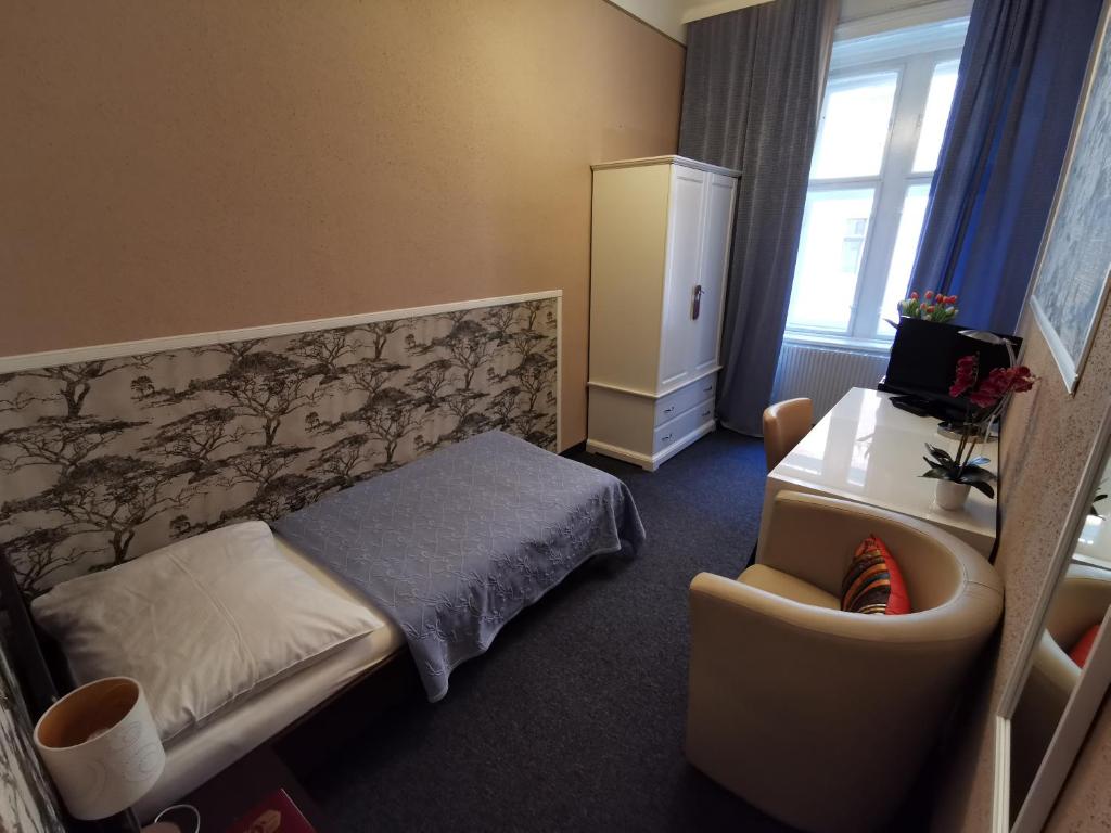 Postel nebo postele na pokoji v ubytování Hotel Bajazzo